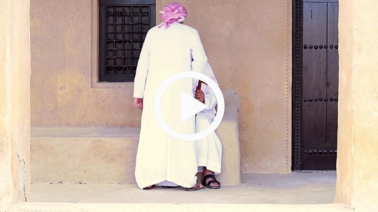 Boy greeting grandfather