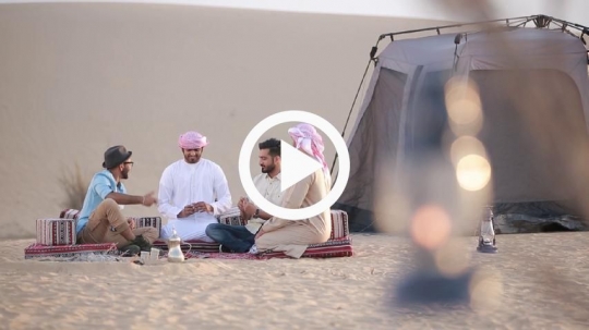 Men playing cards on the floor