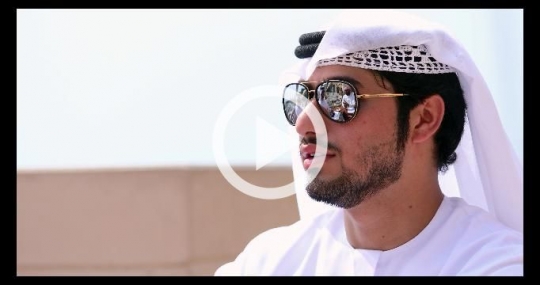 Close up of business man dressed in the traditional attire talking|