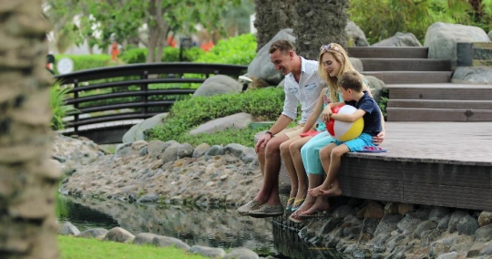 European Family sitting at the lake|-