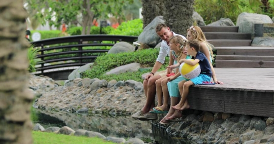 Western Family sitting by the lake|-