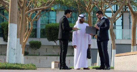 Arab Businessmen talking to the Western Businessman |-