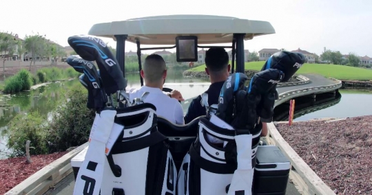 Men driving the golf cart the golf resort|-