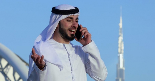 Arab Businessman talking on the phone|-