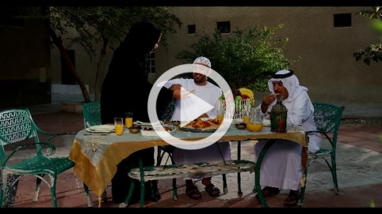 Middle Eastern family praying before Iftar|