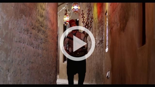 Arabian Ramadan Drink Seller walking through the alleyway |