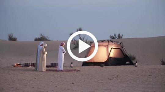 Friends praying outside camp