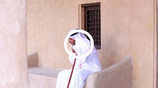 Old man leaning on stick