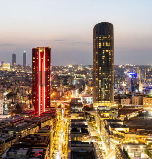  Amman Cityscape at Dusk: The Red Tower and Vibrant Skyline