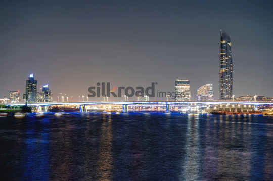 Urban Bridge Over Water at Night