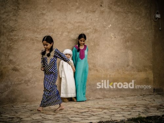 Kids playing hopscotch outside|-
