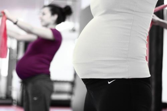 Pregnant Young Lady Exercising 