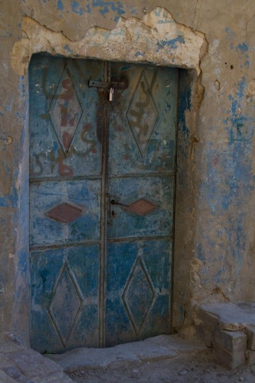 old door in a crumbling buildi