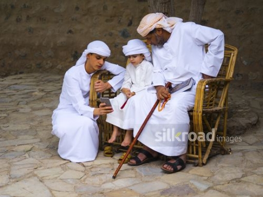 Family gathered over mobile phone|-