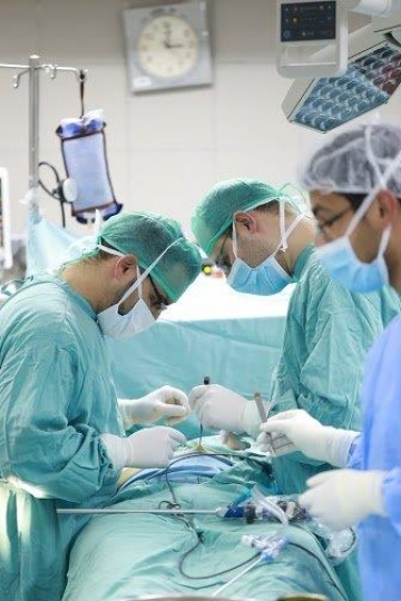 Surgeons Running an Operation