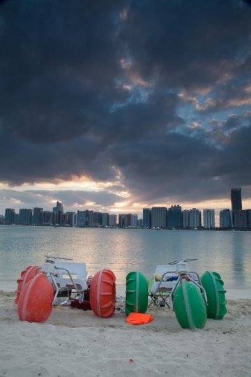 beach cart cycling with city in background