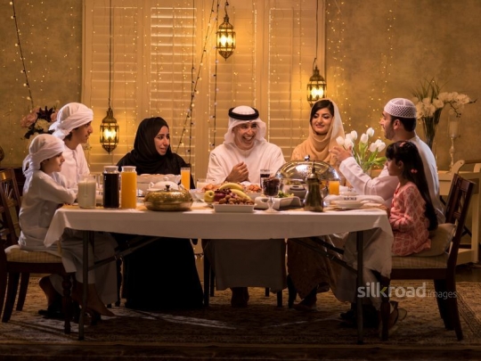 Family gathered around iftar|-