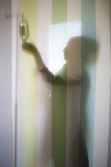 A Woman Doctor Silhouette Hanging Serum on Stand