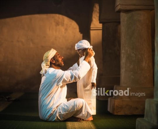 Little boy with grandfather at the mosque|-