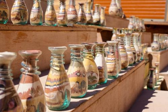 bottles with sand and shapes of desert and camels