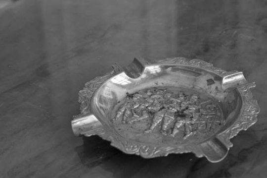 black and white image for old tin ashtray