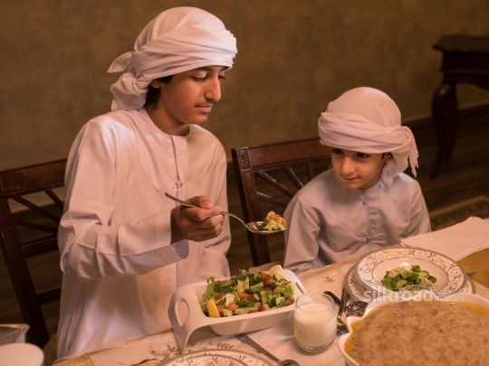 Boys having oriental salad|-