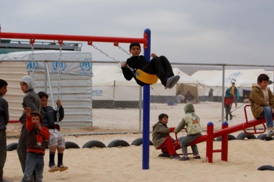 kids play with swing in a refugee camp