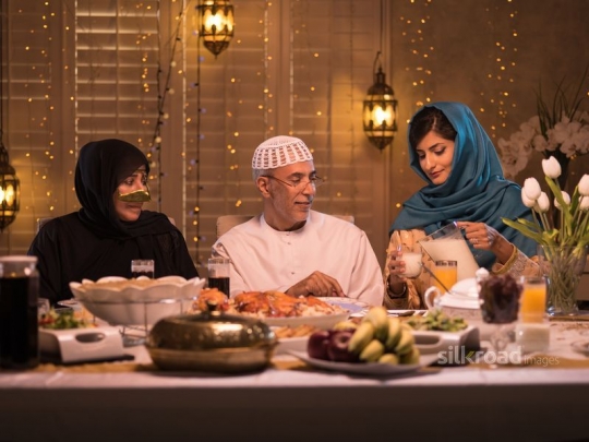 Serving yoghurt drink to parents|-