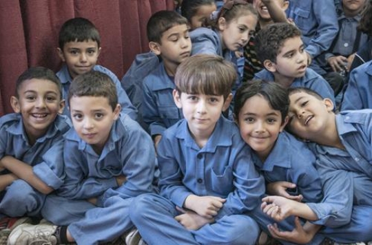 group of schoolchildren looking at camera