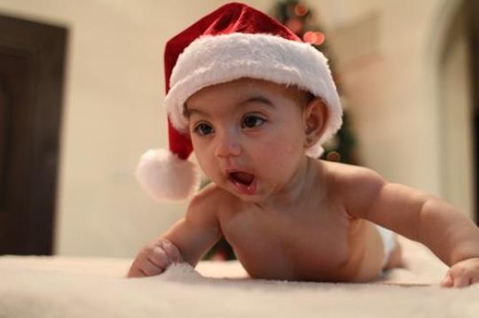 cute baby girl lying on her belly