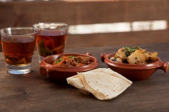 two cups of tea with a ful mud