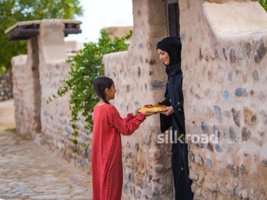 Neighbours sharing food between each other|-