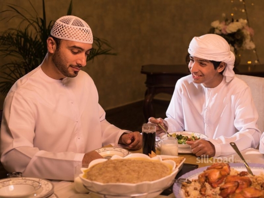 Father checking phone with son|-