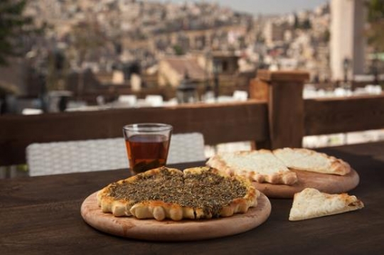 manakish zaatar and cheese with a cup of tea