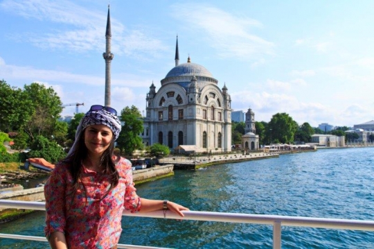 woman standing in front of a m