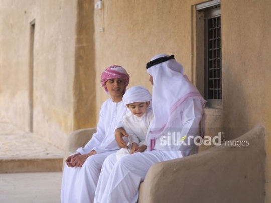 Grandfather sitting with boys|-
