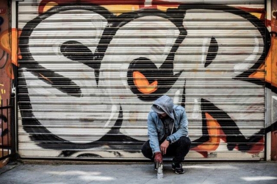 Graffiti Guy Spraying on Wall in Karakoy - Karaköy Istanbul