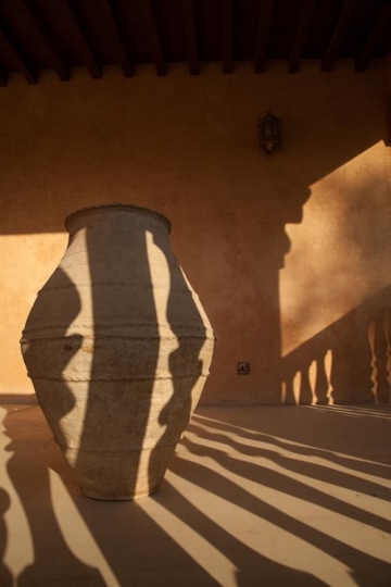 clay vase behind shadows