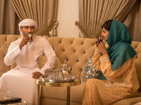 Couple enjoying Arabic tea|-