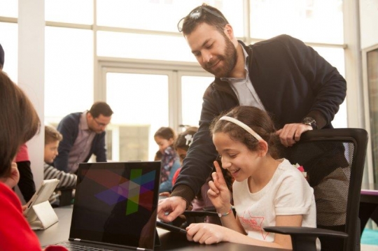 Kids and Teachers at Computer Class