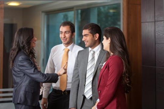 Female Boss Talking to Employees