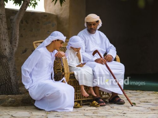 Little boy looking at mobile|-