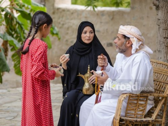 Family enjoying Arabic coffee in the afternoon|-