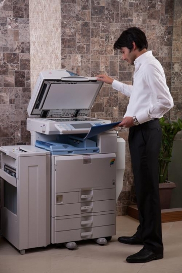 Young Male Employee Photocopying Report