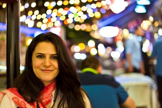 woman posing in front of a camera