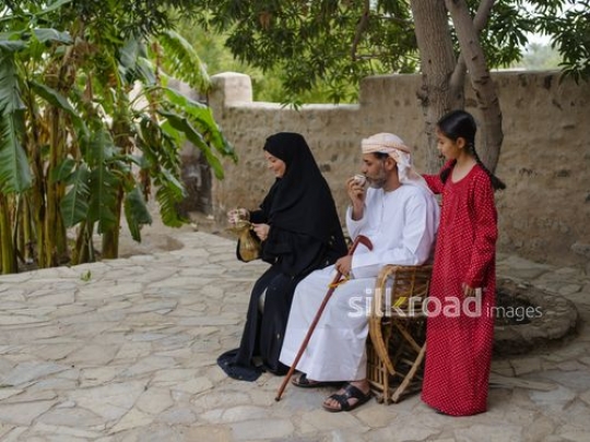 Drinking coffee under the tree|-