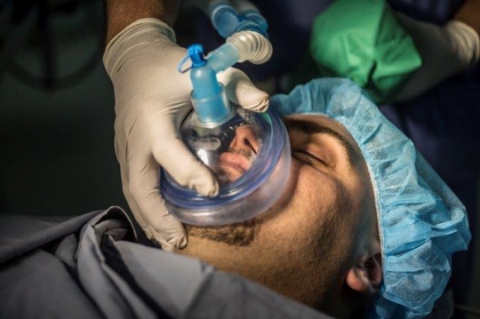 A Patient Under Anaesthetic Face Mask