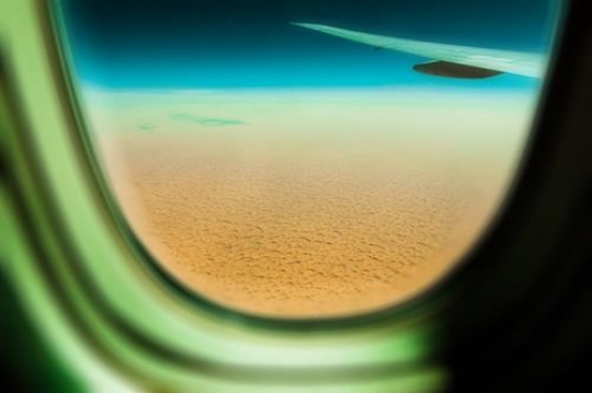 view of saudi arabia desert through airplane window