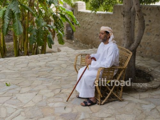 Grandfather sitting on bench|-