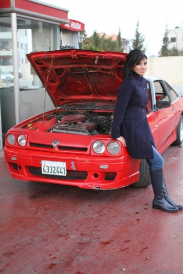 Nice woman mechanic repair broken red car 